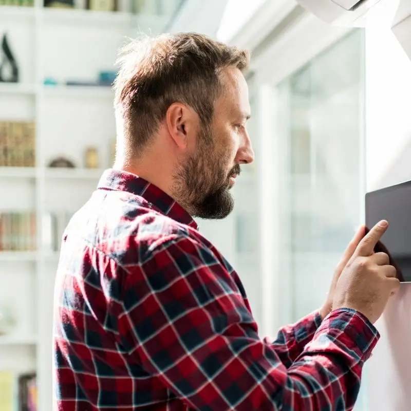 Man using smart technology in his home